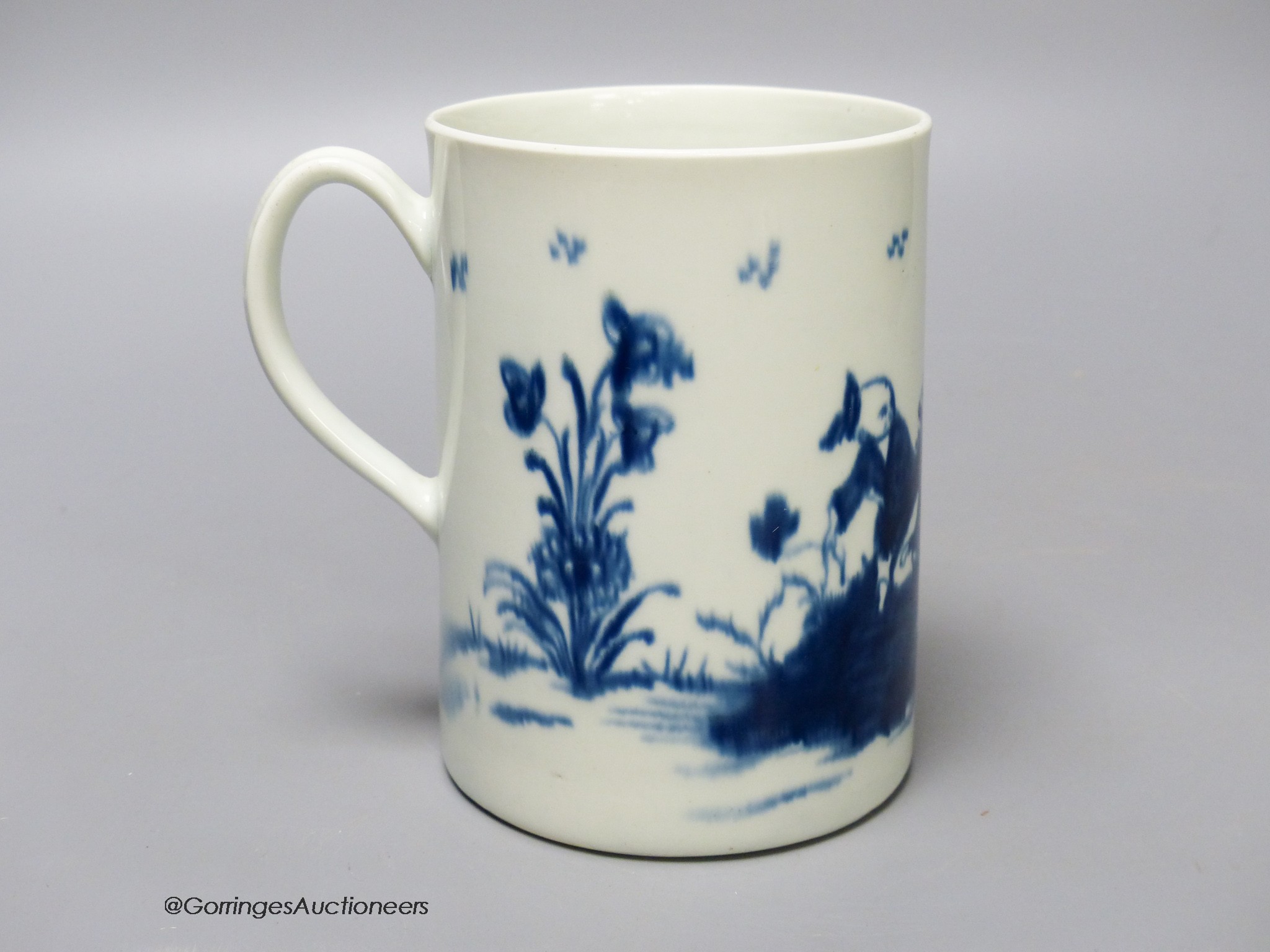 A Worcester 'Gardener' pattern cylinder mug, painted in blue, blue open crescent mark to base. 12.5cm high